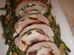 Pork Loin Stuffed with Spinach, Fontina, Parmesan Cheese, and Sun Dried Tomatoes (Serves 8) was pinched from <a href="http://mangiabenepasta.com/holiday_buffet.html" target="_blank">mangiabenepasta.com.</a>