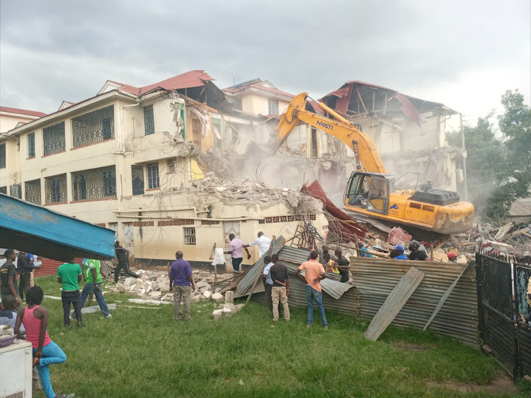 A building built on a sewer line is demolished by Kisumu county government bulldozer at Carwash area on April 20, 2021.