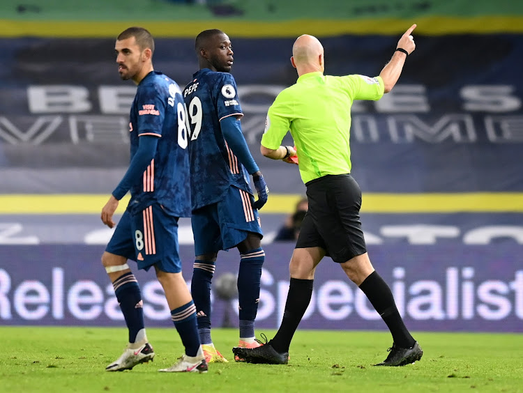 Arsenal's Nicolas Pepe is shown a red card by referee Anthony Taylor