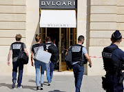 French police stand in front of the Bulgari jewellery store following a robbery at Place Vendome in Paris, France, September 7, 2021. 
