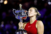 Aryna Sabalenka of Belarus celebrates with the Daphne Akhurst Memorial Cup after winning the Australian Open Women's final against Qinwen Zheng of China in Melbourne.