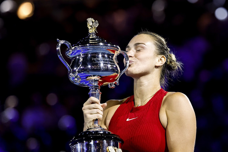 Aryna Sabalenka of Belarus celebrates with the Daphne Akhurst Memorial Cup after winning the Australian Open Women's final against Qinwen Zheng of China in Melbourne.