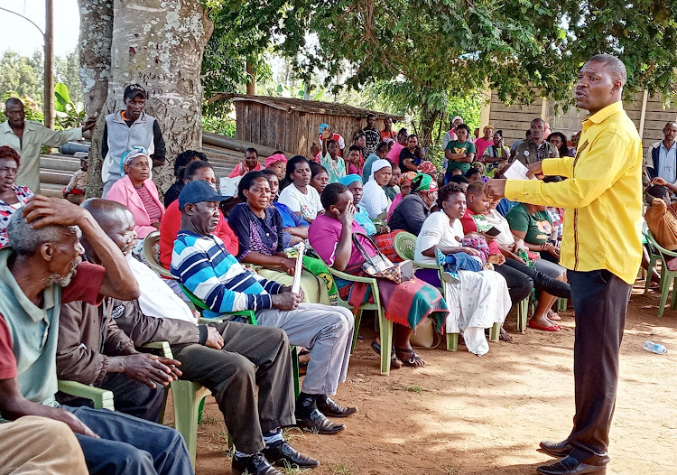 Gichugu MP Gichimu Githinji talks to beneficiaries of the Sh4.8 million Uwezo Empowerment Fund