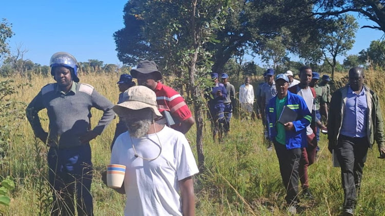 Police raid the farm of Ishmael Chokurongerwa, centre, in Nyabira, Zimbabwe, March 12 2024. Picture: REUTERS/H-METRO/Arron Nyamayaro