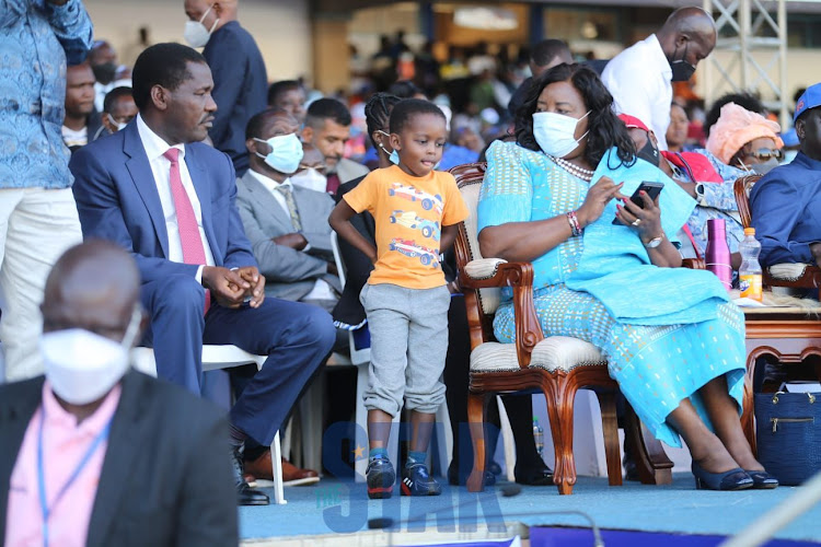 Ida Odinga next to her grandson and Raila Jnr's son, Ryan, at Kasarani on December 10, 2021.