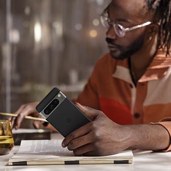 A man using a Google Pixel phone to work.