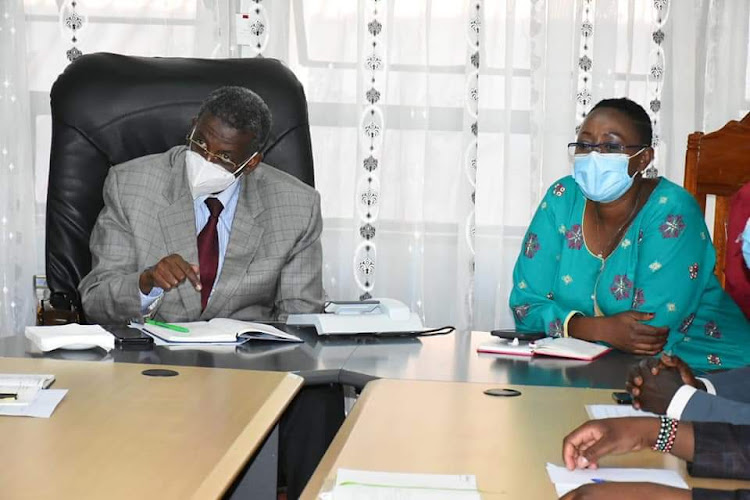 Murang'a county commissioner Mohamed Barre and Woman Representative Sabina Chege during a meeting with deputy county commissioners in Murang'a town on Wednesday