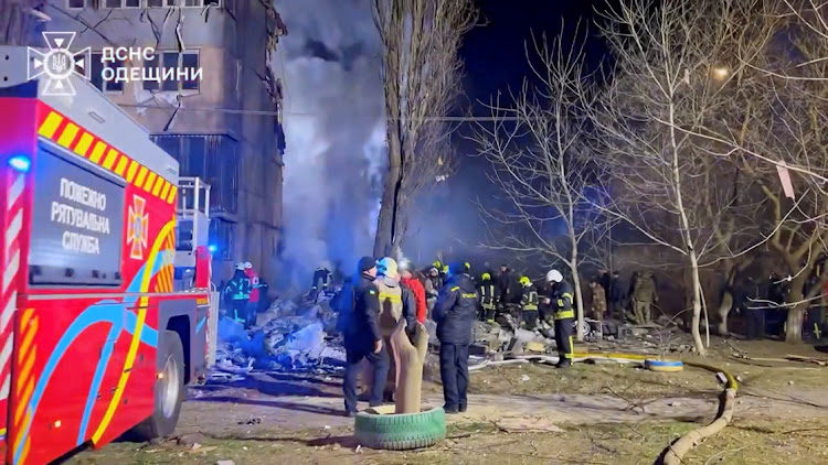 Fire and rescue crews work at the site of a deadly Russian drone attack on an apartment building in Odesa, Ukraine March 2, 2024. Picture: HANDOUT via REUTERS