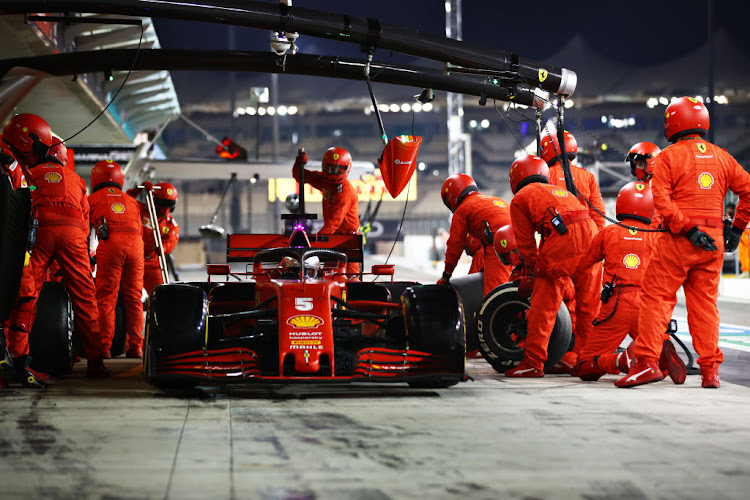 Sebastian Vettel of Germany driving the (5) Scuderia Ferrari SF1000 makes a pitstop during the F1 Grand Prix of Abu Dhabi at Yas Marina Circuit on December 13 2020 in Abu Dhabi.