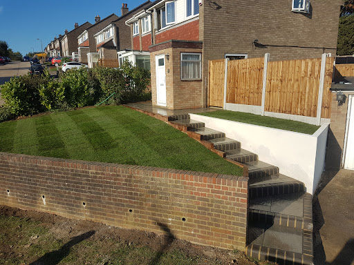 Kandla grey sandstone with charcoal bullnose steps, new lawn, rendered block wall and new fence with