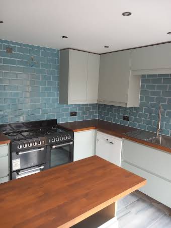 Medium sized Kitchen with an adjoining small bathroom and Floor throughout album cover