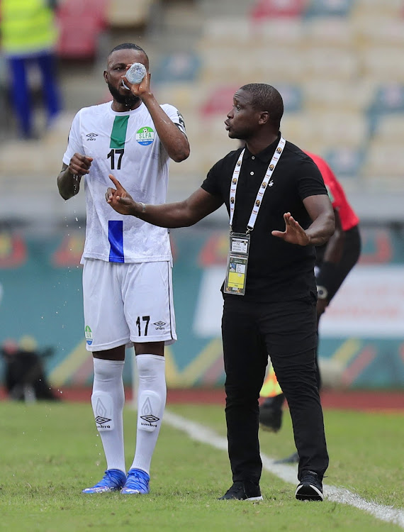 Sierra Leone coach John Keister gives instructions to Umaru Bangura REUTERS/Thaier Al-Sudani