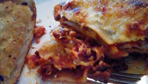 Lasagna noodles, ground beef, ground Italian sausage, tomato sauce, cottage cheese, two cheeses, spices.