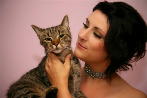 A woman hearts her cat. File picture