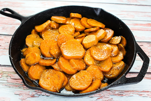 Old Fashioned Candied Sweet Potatoes in a cast iron skillet.