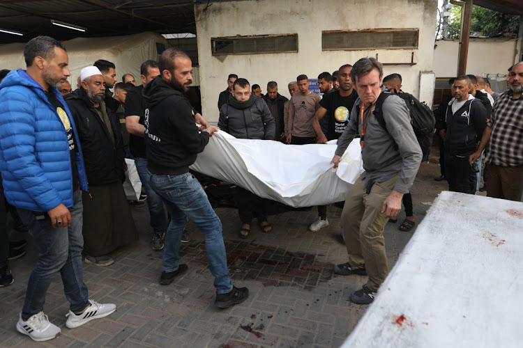 People carry bodies of World Central Kitchen workers who were killed by Israeli air strikes on Tuesday. Picture: AHMAD HASABALLAH