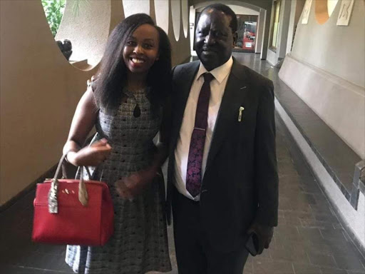 AU envoy Raila Odinga with blogger Pauline Njoroge in Zimbabwe on Monday, November 26, 2018. /TWITTER