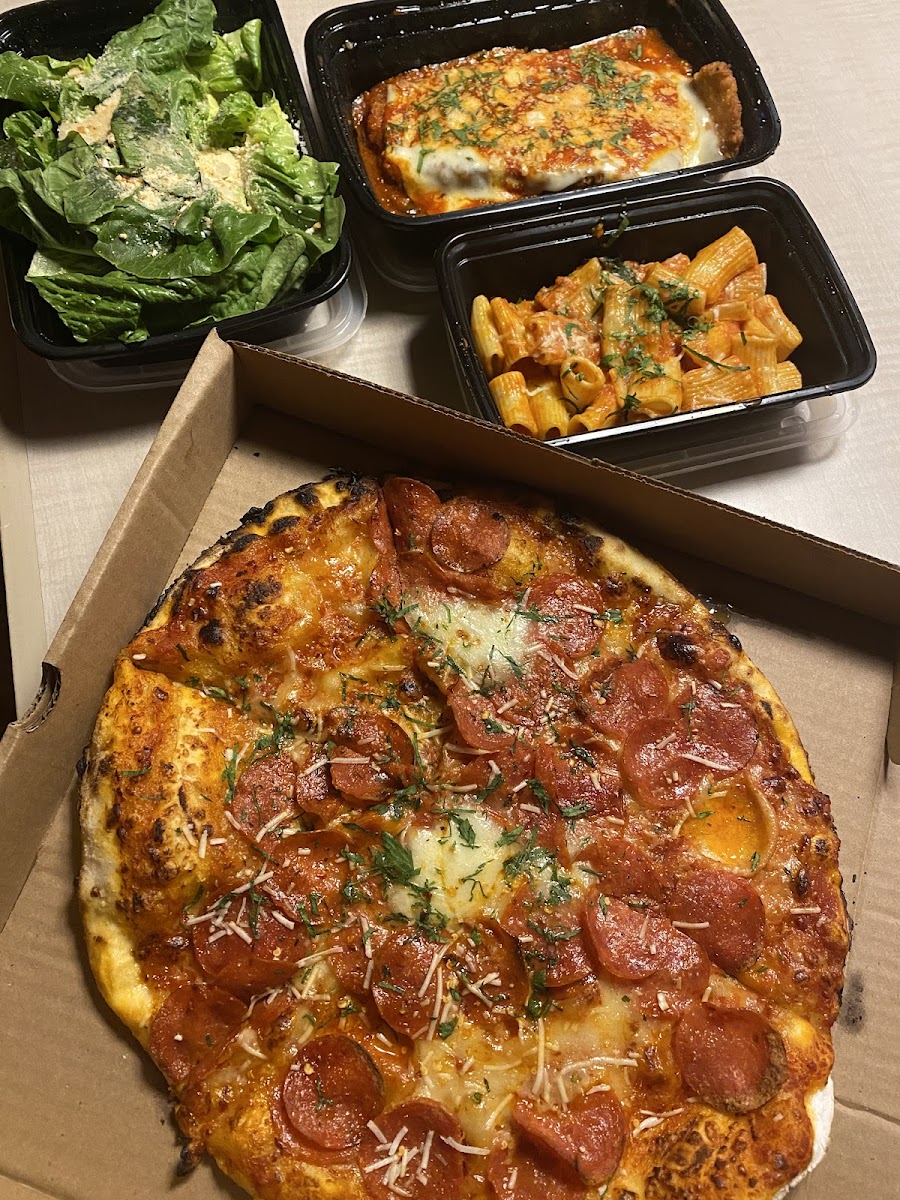 Pepperoni pizza, eggplant parm and caesar salad