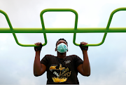 A man wearing a protective face mask trains at an outdoor gym after Brussels regional government ordered gyms and cultural facilities to close, as coronavirus disease infections in Belgium continued to surge to record highs, in Brussels, Belgium on October 26 2020. 
