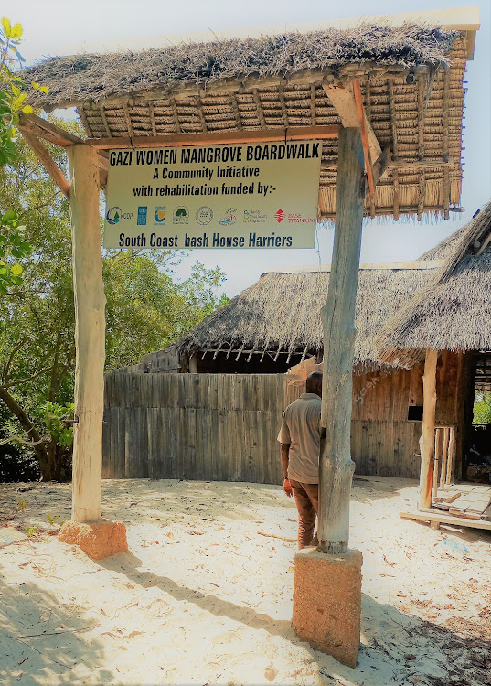 A sign board to the Gazi Women Mangrove Boardwalk in Kwale