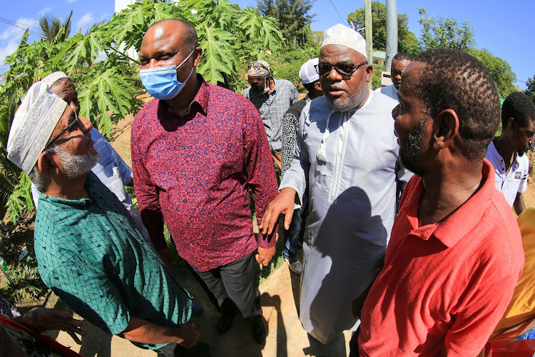 Kwale Senator Issa Boy and his Mombasa counterpart Mohamed Faki at the Kikowani cemetery on Thursday during the burial of former Mombasa mayor Ahmed Mwidani.