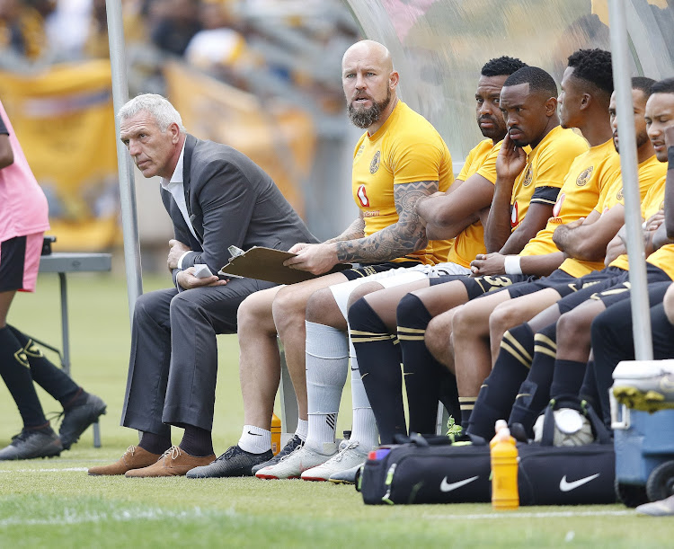 Ernst Middendorp and his bench look on during a match.