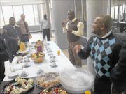 HEATED UP: 
      Journalist Tom Nkosi (far right in a blue Argyle jersey) and Mpumalanga cooperative governance and traditional affairs HOD David Mahlobo
      
       (far left in a grey suit). 
      
      PHOTO: Riot Hlatshwayo