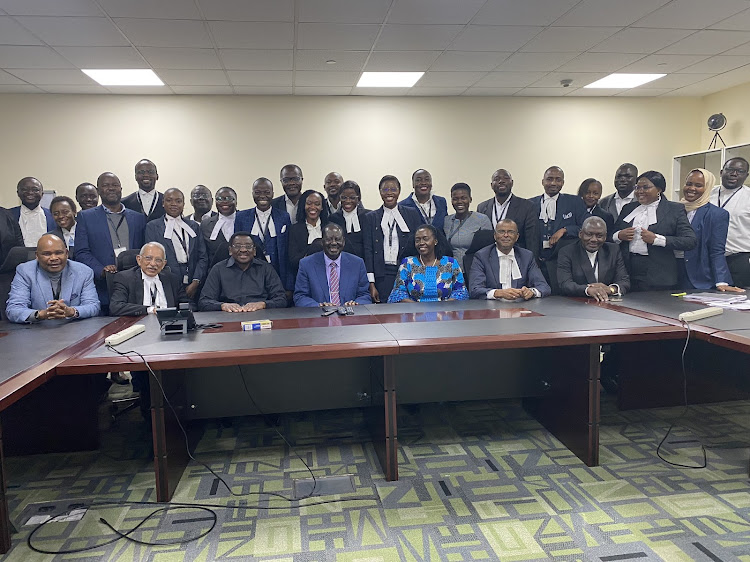 Azimio presidential candidate Raila Odinga, his running mate Martha Karua and Prof Makau Mutua posing for a photo with their lawyers on September 2,2022.