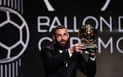 Real Madrid's French forward Karim Benzema receives the Ballon d'Or award during the 2022 Ballon d'Or France Football award ceremony at the Theatre du Chatelet in Paris on October 17, 2022.