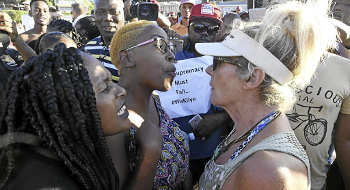 Incidents such as the racial confrontation at a Clifton beach that saw a sheep slaughtered as part of a ceremony to end "racism" at that beach will get worse as elections near./Brenton Geach/Gallo Images