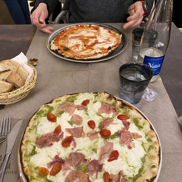 In the foreground my delicious gluten free Praga pizza. In the background a regular Margherita.