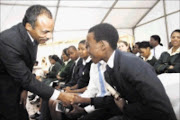 DREAM: American Johnny Mack greeting one of the pupils at the 'Separate is not equal' launch in Durban. Pic: Thuli Dlamini. 06/10/2009. © Sowetan.