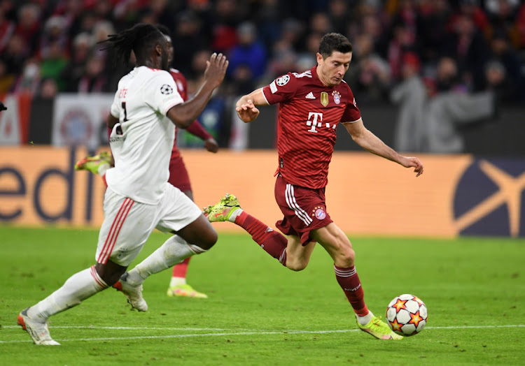 Bayern Munich's Robert Lewandowski scores their fourth goal.