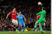 Atletico Madrid's keeper Jan Oblak makes a crucial save during the match. 