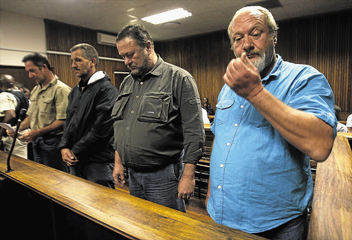 From right: Johan Prinsloo, Hein Boonzaaier, Martin Keevy and Mark Trollip, appear in the Bloemfontein Magistrate's Court. They are accused of plotting to assassinate President Jacob Zuma and members of the ANC executive. File photo