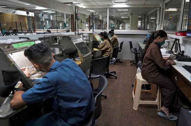 Employees work at a diamond jewellery manufacturing factory in Mumbai, India. File photo: REUTERS/HEMANSHI KAMANI