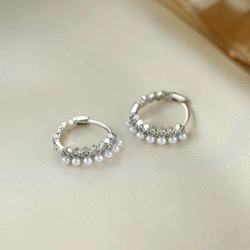 Women's Fashion Sterling Silver Artificial Pearl Earrings. Enhance your style with these elegant and timeless earrings. 