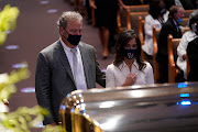 Cal McNair, chairman and chief executive officer of the Houston Texans, pauses at the casket bearing the remains of George Floyd in the chapel during his funeral service at the Fountain of Praise church June 9, 2020 in Houston, Texas. Floyd died May 25 while in Minneapolis police custody, sparking nationwide protests. 