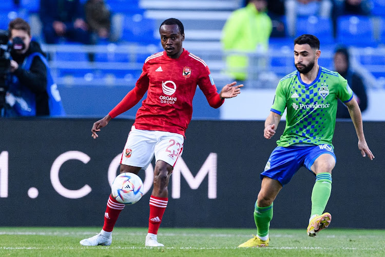 Percy Tau, left, and Alex Roldan during the Fifa Club World Cup Morocco 2022 second round match between Al Ahly and Seattle Sounders FC at Morocoo's Ibn Batouta Stadium on February 4 2023.