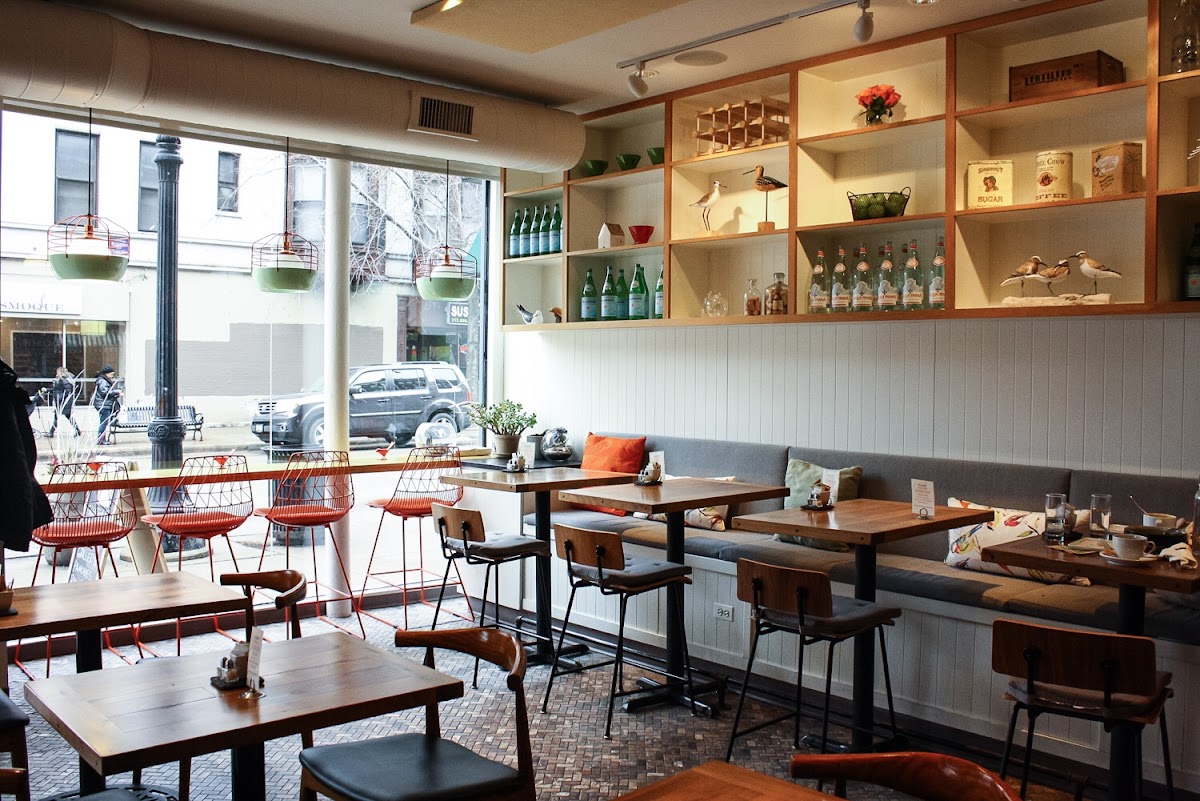 Adorable interior is so fresh and inviting. Loved the cutely appointed bookshelves and big windows.