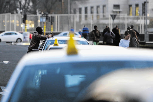 Taxis near the Sandton Gautrain station, where passengers and drivers of Uber vehicles were harassed allegedly by drivers of metered taxis. File photo.