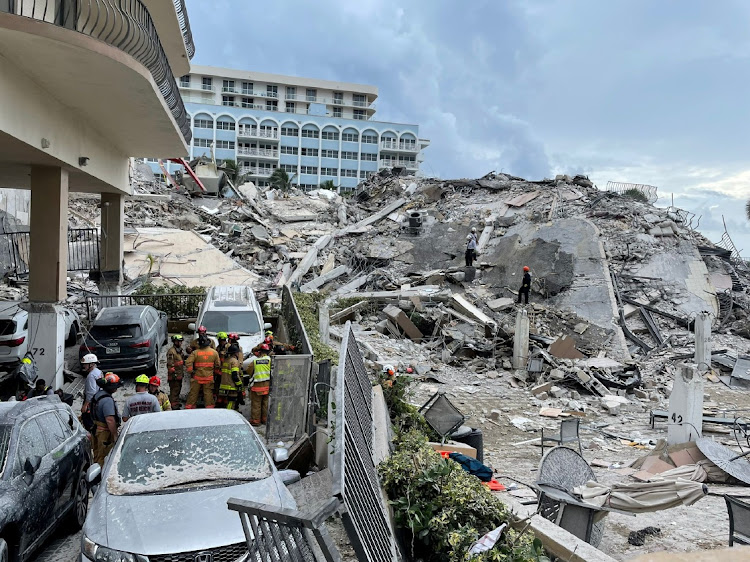 Emergency personnel continue to search at the site of a partially collapsed building in Surfside, near Miami Beach, Florida, US, on June 25 2021. Picture: MIAMI-DADE FIRE RESCUE DEPARTMENT/HANDOUT via REUTERS