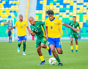 Bafana Bafana's Percy Tau challenges Emmanuel Imanishimwe of Rwanda in their 2026 Fifa World Cup group C qualifier at Stade Huye in Butare, Rwanda, on Tuesday.