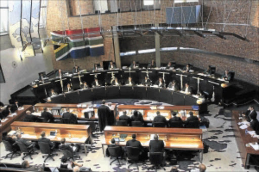 POINT OF ORDER: A full bench of Constitutional Court judges listen to arguments by lawyers representing suspended National Director of Public Prosecutions, Menzi Simelane yesterday. PHOTO: BUSISIWE MBATHA