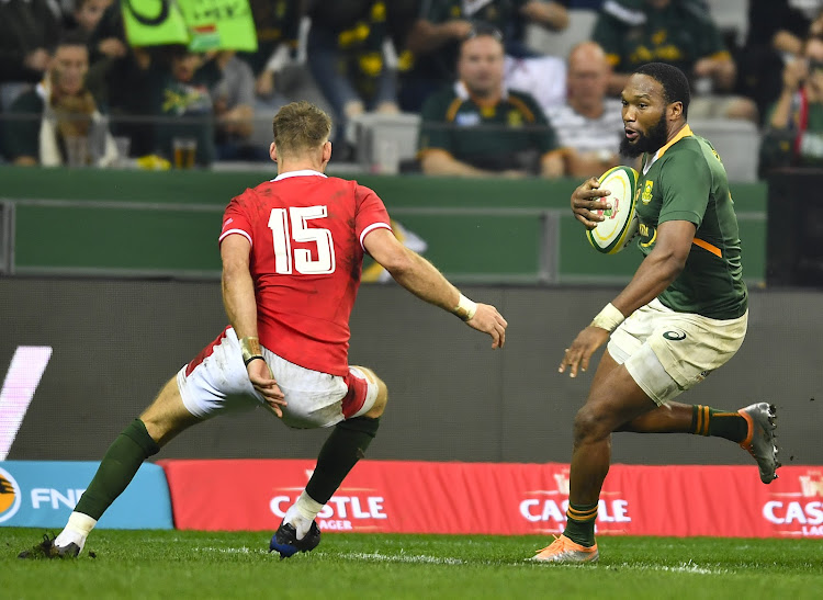 Lukhanyo Am charges forward for the Springboks during the third Castle Lager Incoming Series Test match against Wales at the DHL Stadium in Cape Town