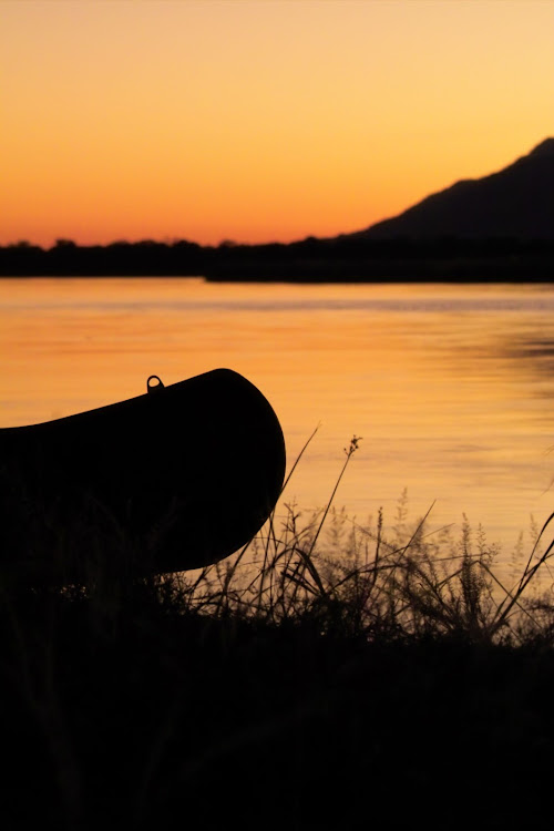 A canoe on the banks of the Zambezi. Poachers cross the river in them to lay wire snares.