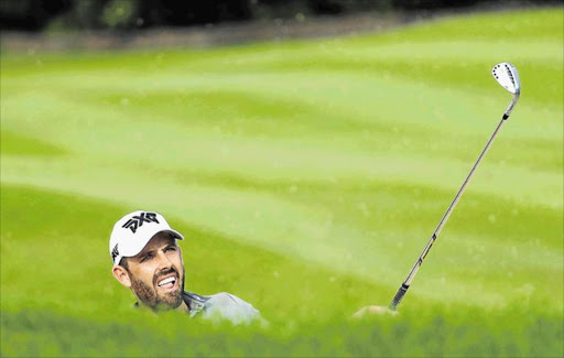 PRACTICE MAKES PERFECT: Charl Schwartzel of South Africa plays out of a bunker on the 14th during day one of The Alfred Dunhill Championship at Leopard Creek Country Golf Club yesterday.