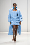 Model walking The Bam Collective SA Fashion Week Spring Summer 2024 runway in cerulean blue ensemble