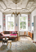 The living room is one of three rooms in which the beautifully-moulded stucco ceiling was painstakingly restored.