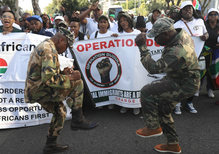 Operation Dudula members sing and dance during the movement's launch in Western Cape. File Photo